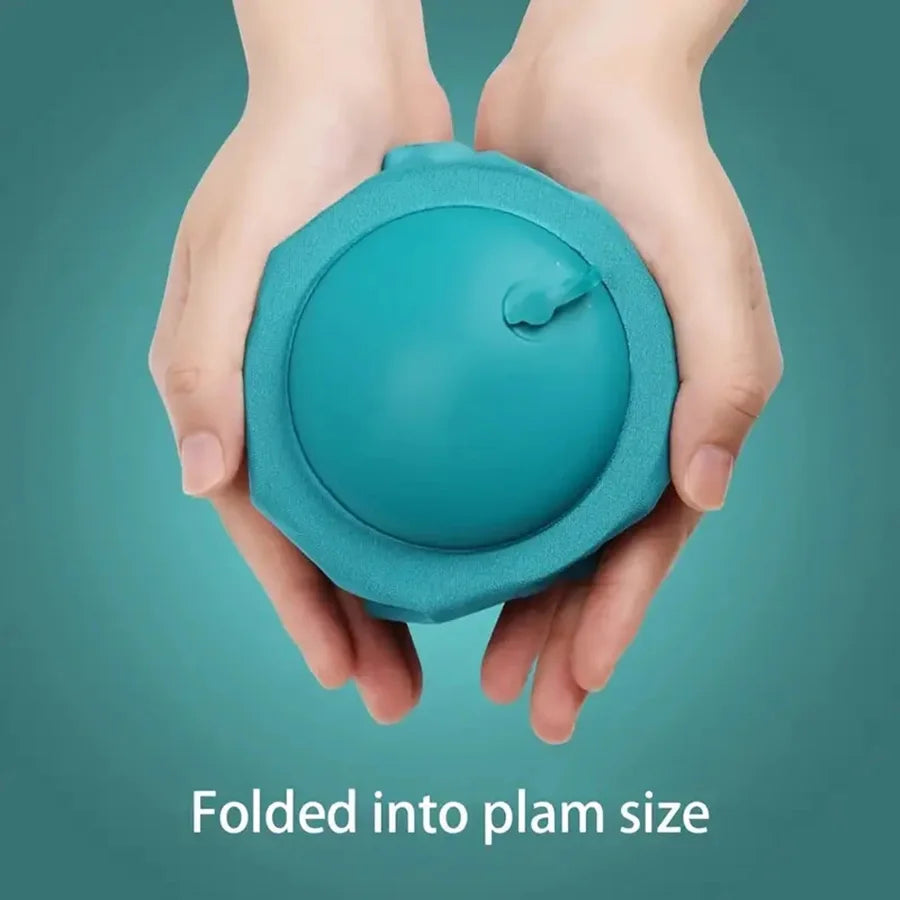 A hand holds a teal folded inflatable neck pillow against a blue-green background.