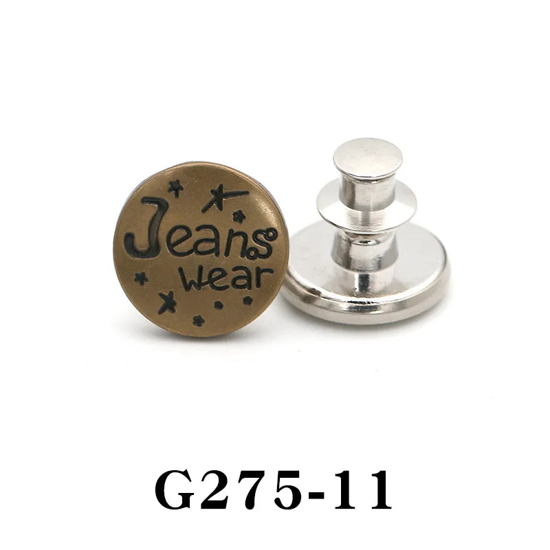 A round brass button pin with the text Jeans Wear engraved on it, next to a silver adjustable pin.