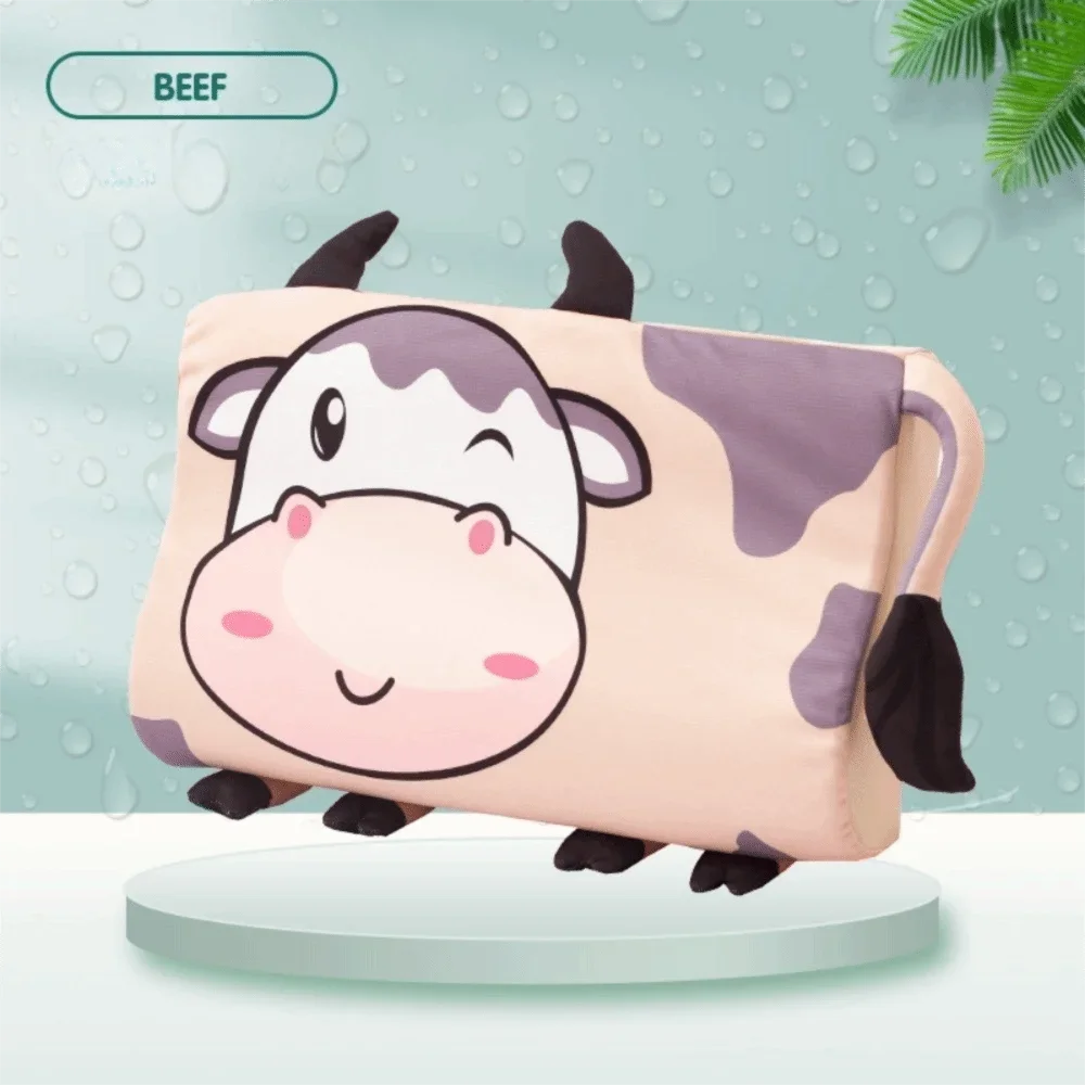 A cute cartoon cow shaped memory foam neck pillow for toddlers in pink and white.