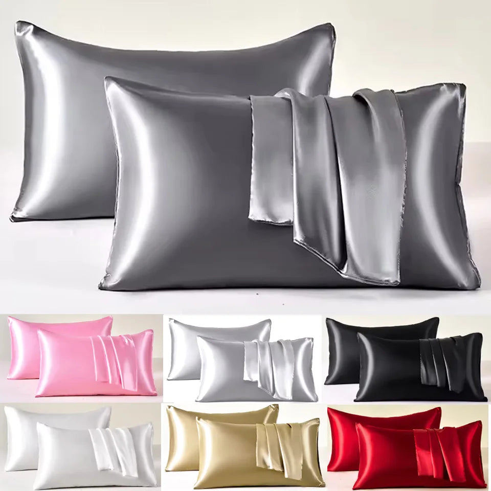 A collection of satin pillowcases in various colors including silver, black, pink, gold, and red.