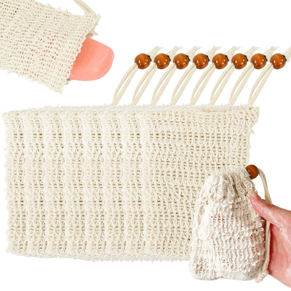 A beige mesh bag filled with natural sisal soap savers and a pink soap bar.