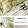 A fluffy lime green rabbit plush pillow and blanket set with a white background.