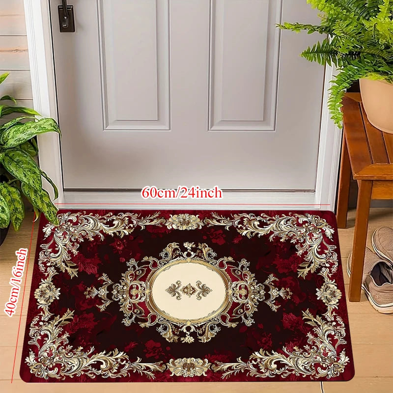 A deep burgundy luxury floral area rug with gold accents displayed in a doorway setting.