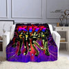 A purple and pink printed flannel travel blanket featuring a group of stylized figures.