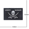 Black embroidery patch featuring a skull and crossbones design with the text Liberty or Death.