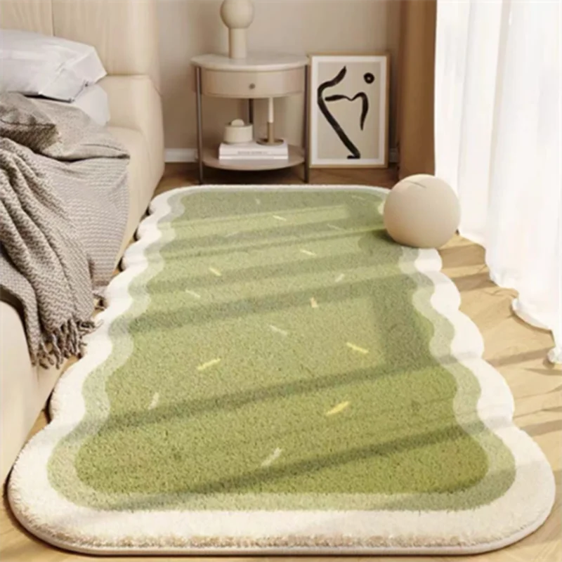 A rectangular light green rug with striped patterns is displayed on a wooden floor next to a sofa and a side table.