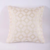 A square throw pillowcase made of beige chenille jacquard fabric with a diamond pattern.