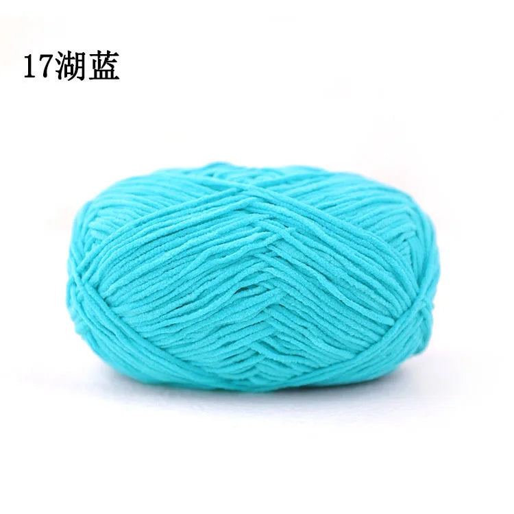 A ball of bright turquoise 3mm matte chenille yarn for knitting and crochet.