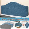 A blue upholstered headboard cover with a leaf pattern shown on a bed.