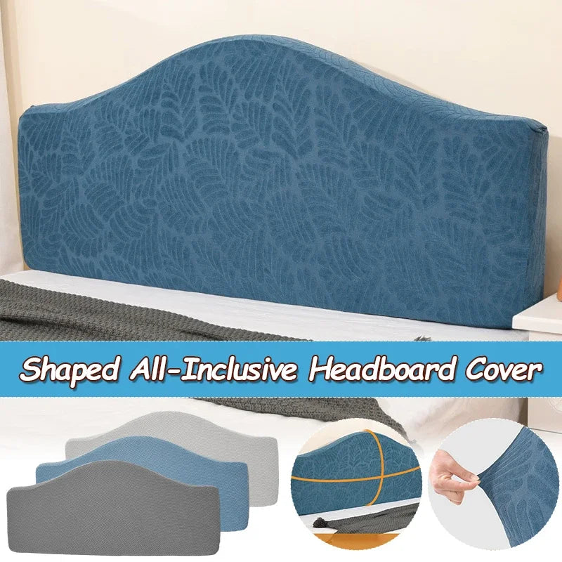 A blue upholstered headboard cover with a leaf pattern shown on a bed.
