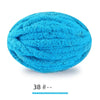 A ball of bright turquoise blue extra thick hand-knitted yarn for crafting and gifts.