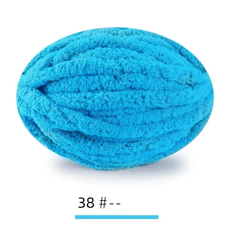 A ball of bright turquoise blue extra thick hand-knitted yarn for crafting and gifts.