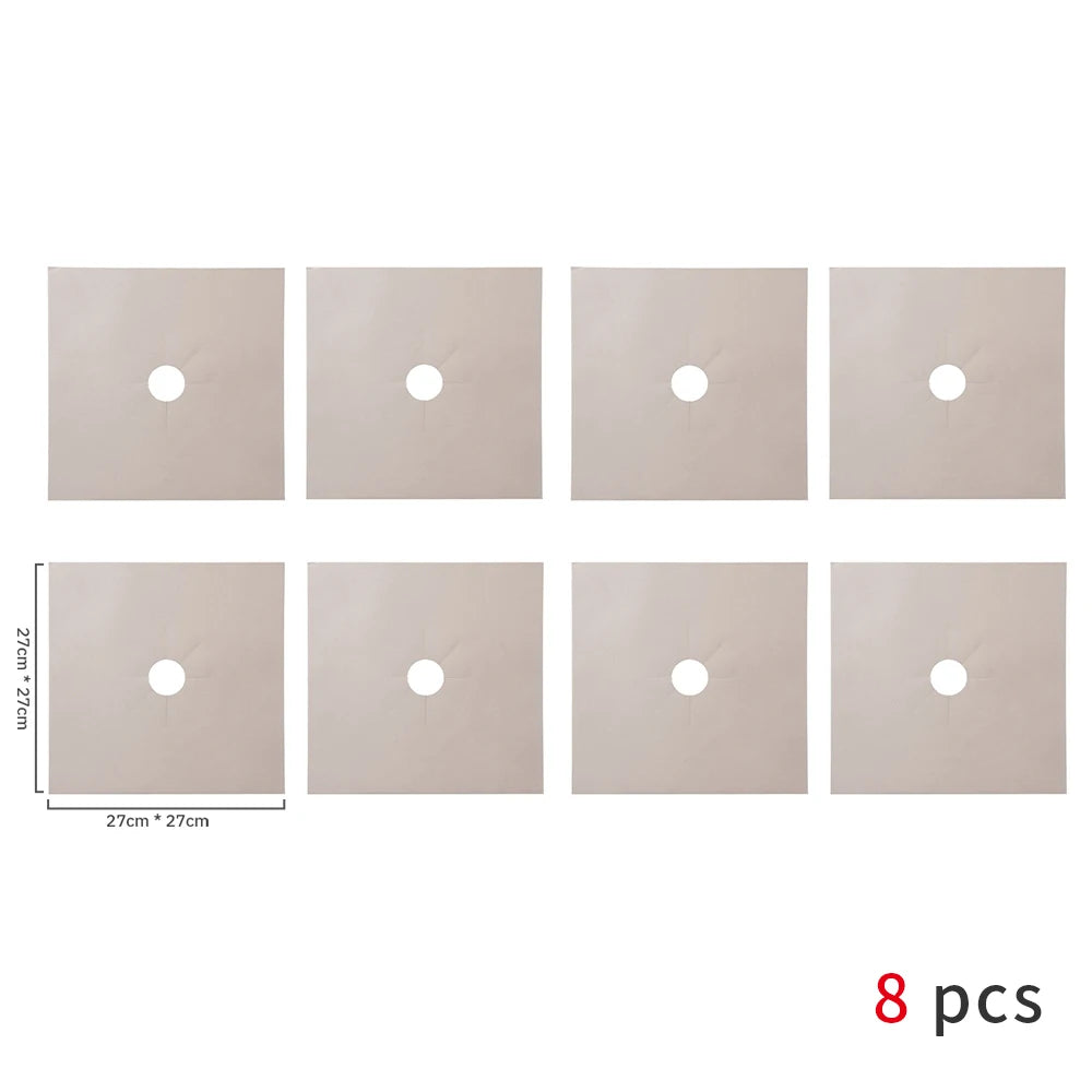Set of eight square gas stove protectors in a light beige color