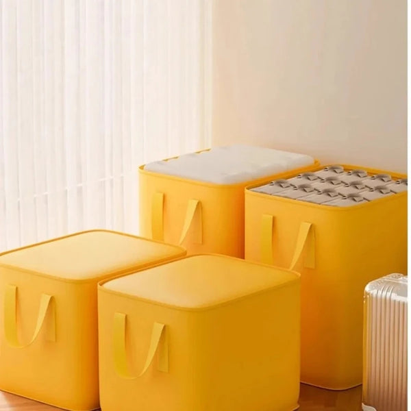 Two bright yellow heavy duty foldable storage sacks with white lids are shown next to a window.