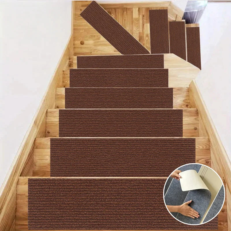 A set of self-adhesive brown textured mats installed on a wooden staircase and door frame.