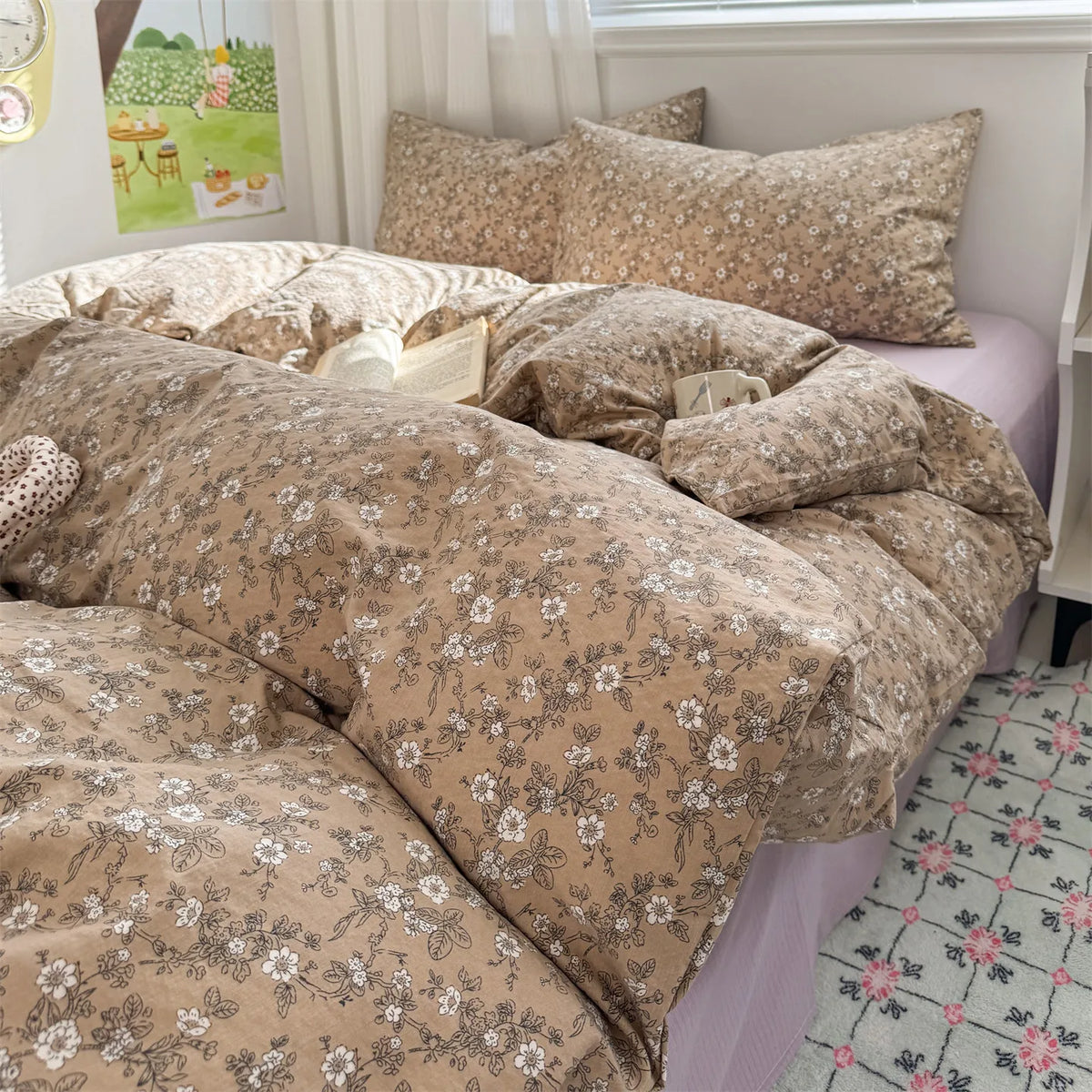 A beige floral microfiber duvet set with matching pillows displayed on a bed.