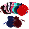 A set of ten velvet drawstring gift bags in various colors, including pink, purple, green, and red.