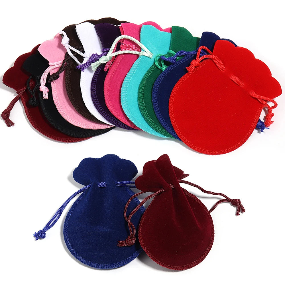 A set of ten velvet drawstring gift bags in various colors, including pink, purple, green, and red.