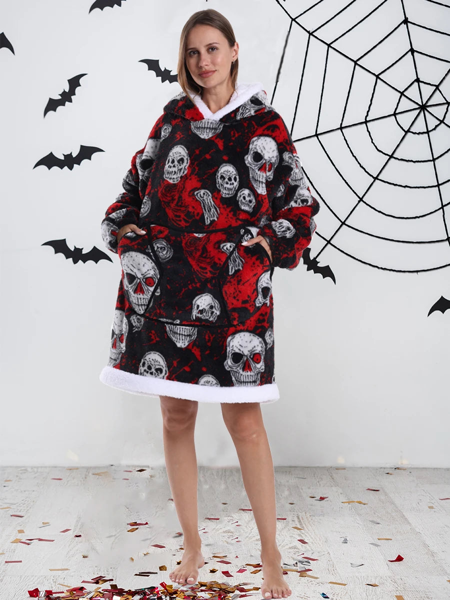 A woman models an oversized patchwork fleece hoodie featuring a skull print against a white background with black bats.