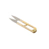 A pair of gold-toned U-shape sewing scissors used for cutting thread, yarn, fabric, and needlework.