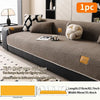 A beige fleece sofa mat with a cushion and decorative pillows displayed on a modern sofa.