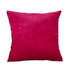 A square velvet throw pillow cover in a deep magenta color.