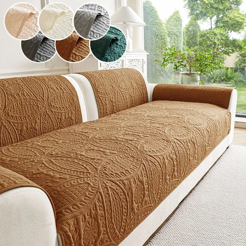 A brown textured sofa cushion with white trim is shown indoors near a window.