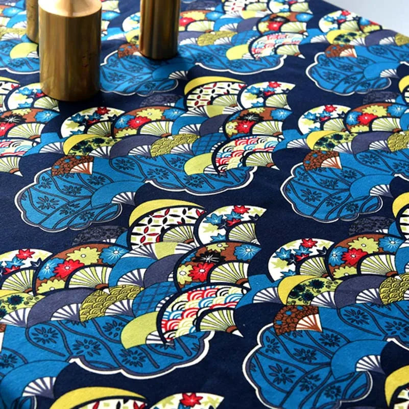 Close-up of blue and yellow bohemian printed linen fabric with floral patterns.