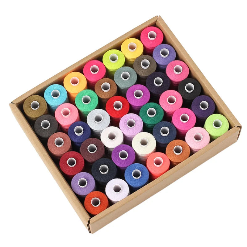 A collection of 42 colorful polyester thread spools in various shades are arranged in a wooden box.