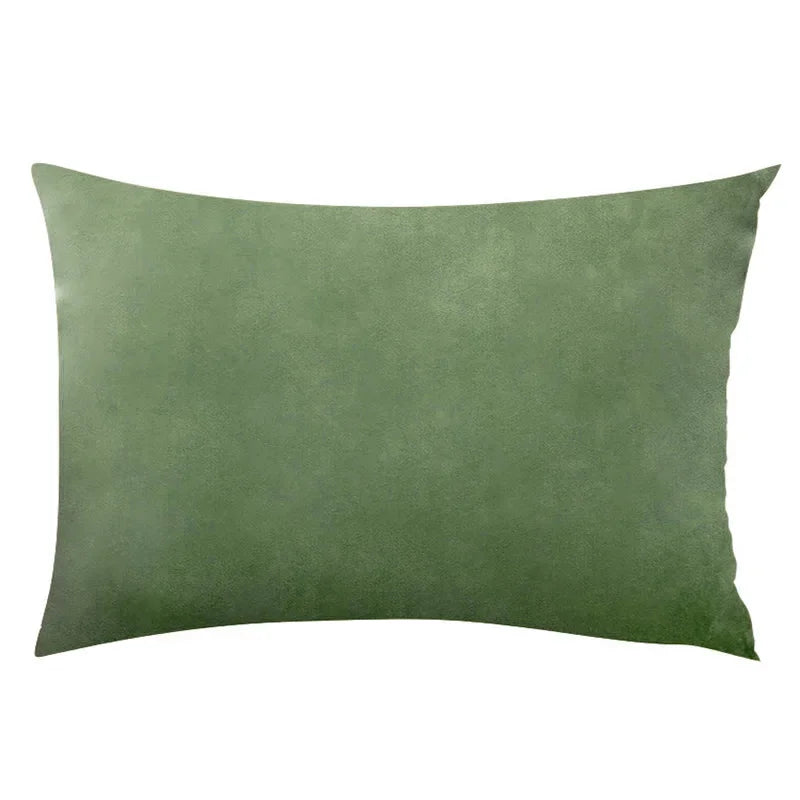 A solid olive green velvet throw pillow cover.