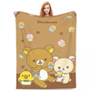 A brown and beige cartoon illustration featuring a large bear hugging a small yellow bear and a cupcake.