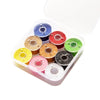 A clear plastic box containing assorted embroidery sewing threads in various colors like blue, red, green, and yellow.