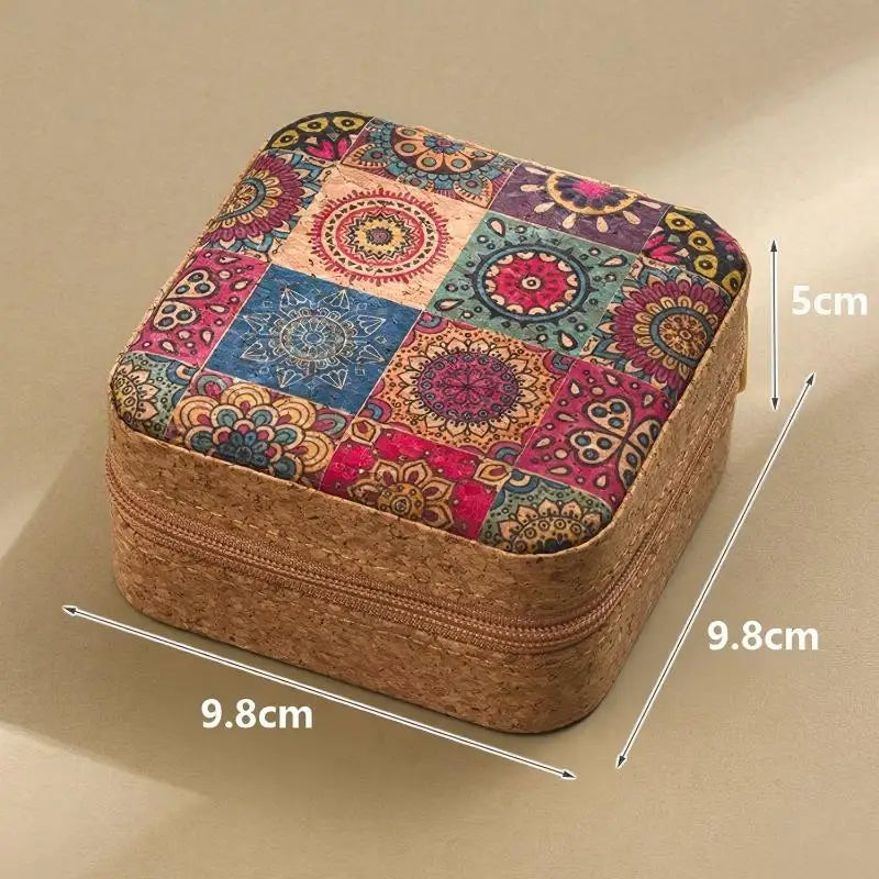 A rectangular storage box with a woven texture and a colorful patchwork lid featuring floral and geometric patterns.