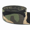 A roll of camouflage elastic stretch ribbon for sewing and craft projects in green, brown, and black patterns.