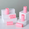 A set of pink invisible sheet clips for securing bedding, displayed in white foam holders.