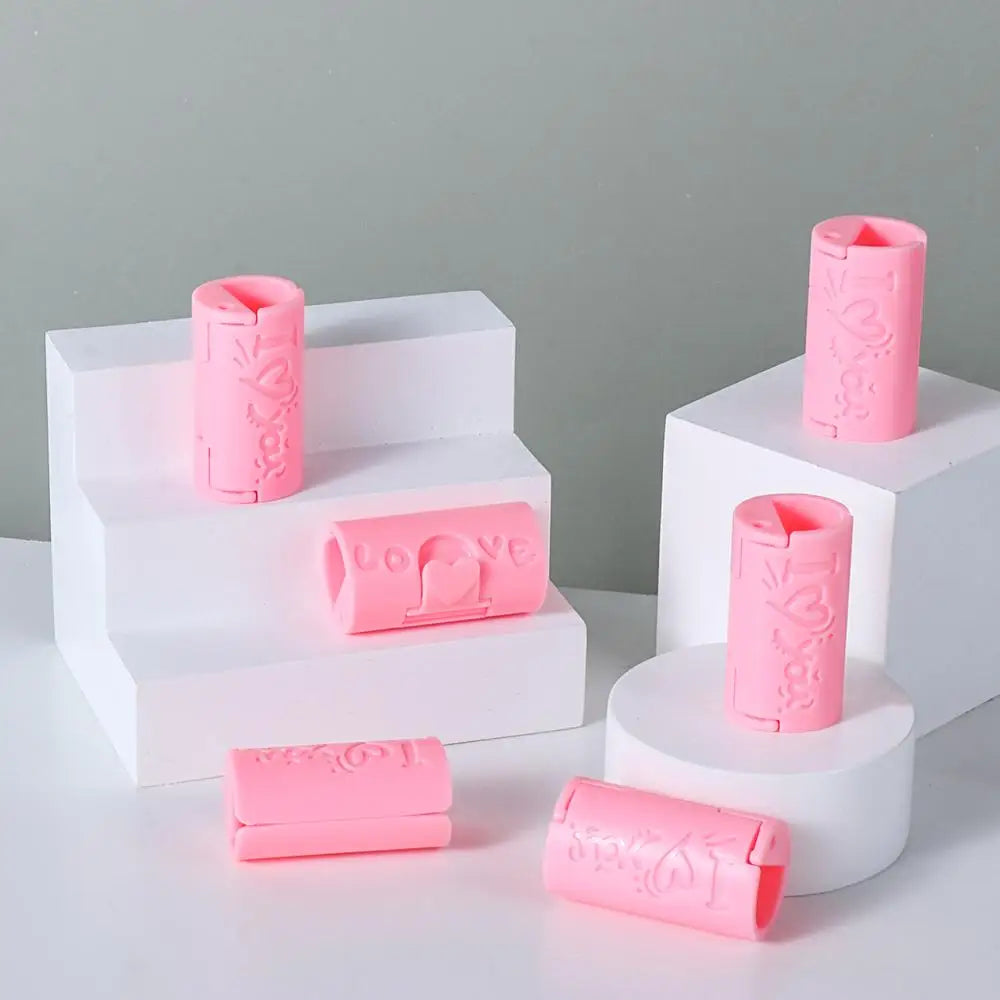 A set of pink invisible sheet clips for securing bedding, displayed in white foam holders.