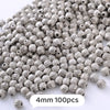 A pile of silver metallic geometric beads, 4mm size, for jewelry making.