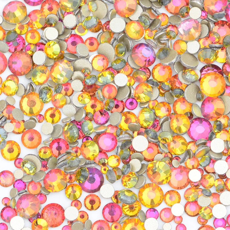A pile of mixed clear glass and colored rhinestones for DIY crafts