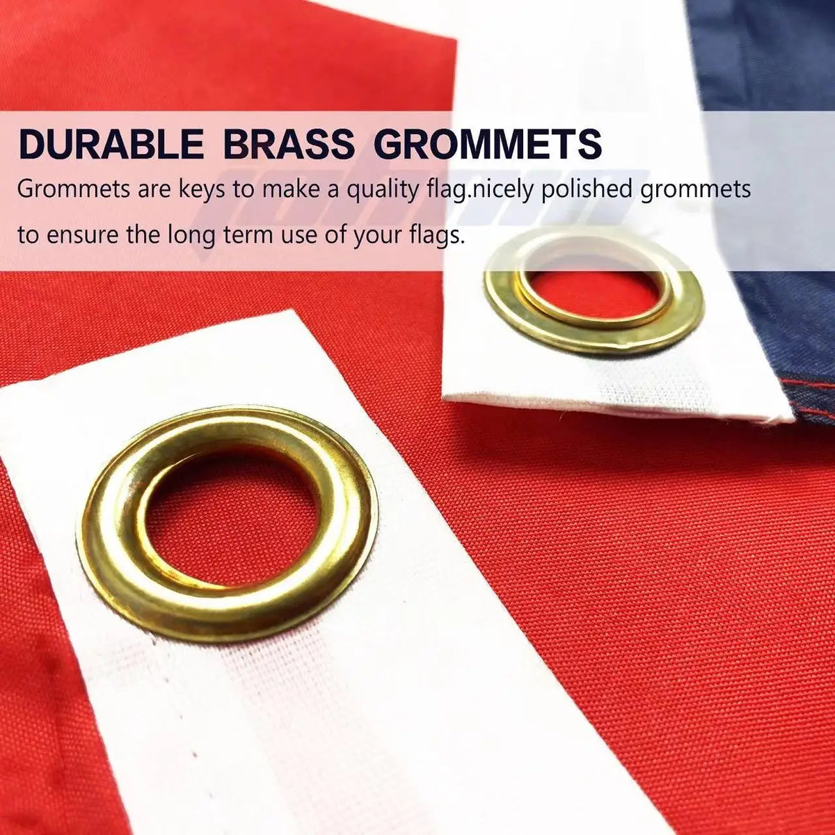 Close-up of a brass grommet used to secure a flag on a white fabric background.