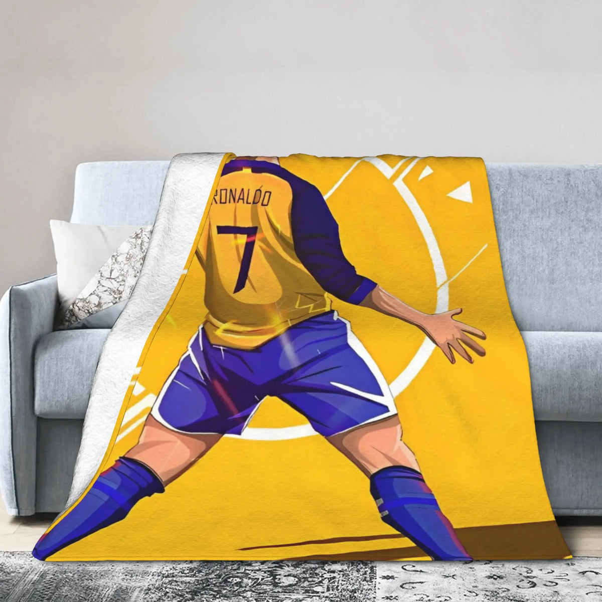 A yellow and blue football player graphic on a throw blanket.