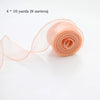Roll of sheer peach organza ribbon measuring 4 x 10 yards for crafting and wrapping
