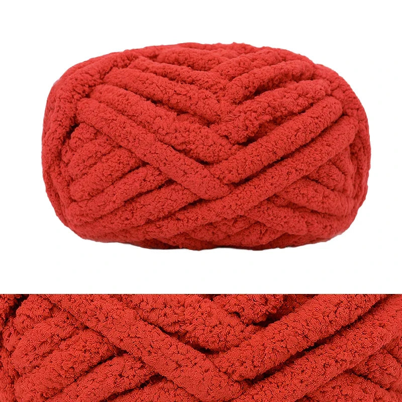 A tightly knitted, textured red wool finger line scarf in a spherical shape.