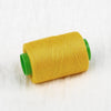 A spool of bright yellow sewing thread with a green core.