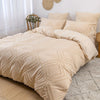 A beige bohemian grid tufted duvet cover set displayed on a bed with natural light and white curtains.