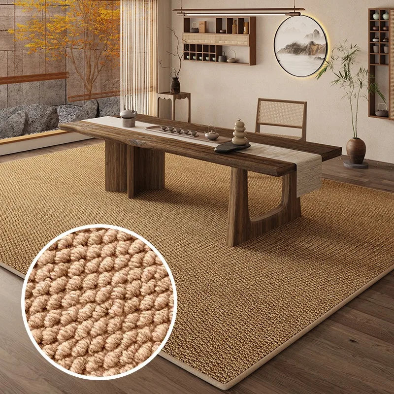 A woven faux sisal runner rug laid on a wooden table in a modern interior setting.