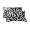 Two leopard print decorative pillow covers in gray and black spots.