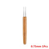 A single wooden precision crochet hook with a fine point is shown.