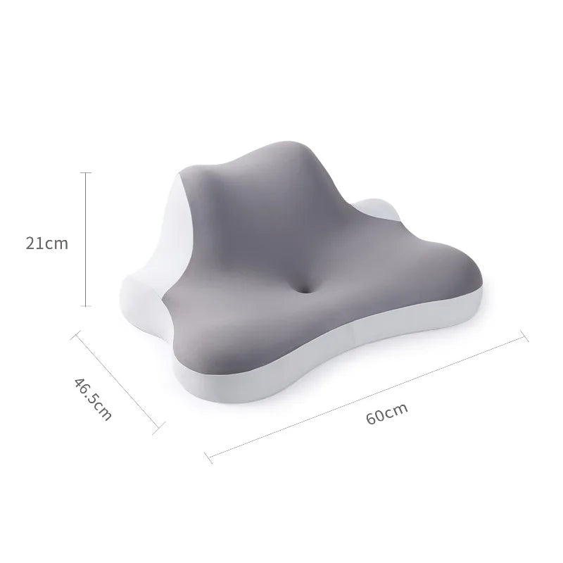 Gray ergonomic wedge pillow with white trim shown from the side and top view.