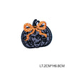 Black embroidered pumpkin patch with an orange ribbon detail
