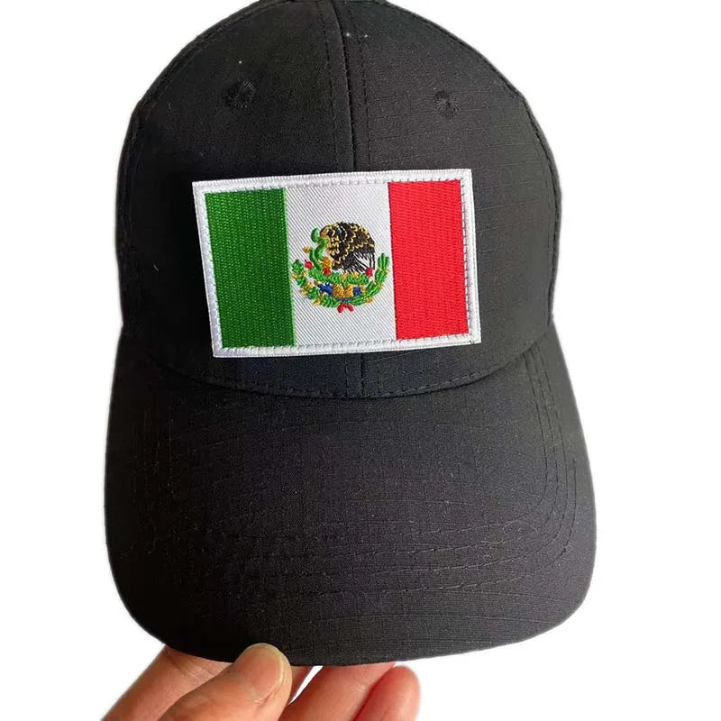Black baseball cap with an embroidered Mexican flag patch on the front